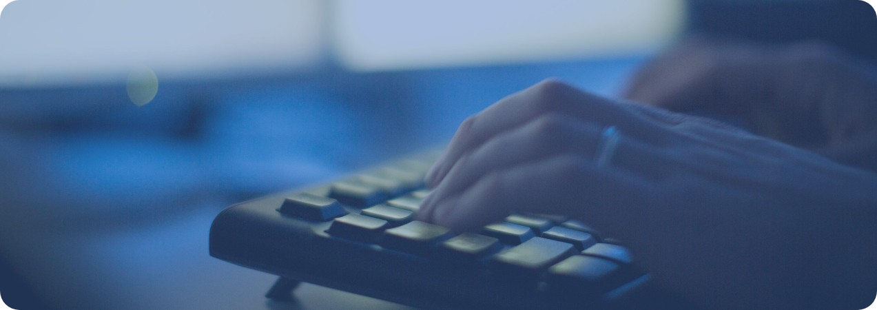 Hands typing on keyboard